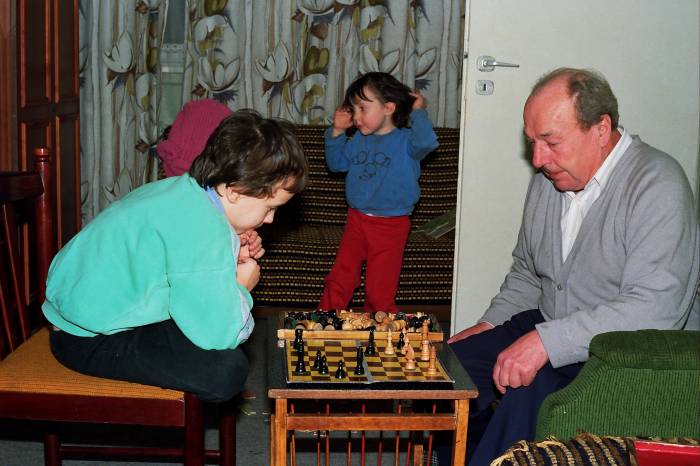 My brother playing with grandfather - I'm the small one in the background
